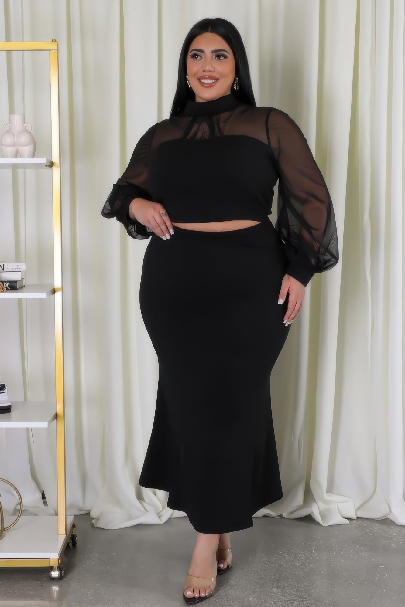 Curvy Glam Stretch Skirt Set in black with mesh accents, long sleeves, and high-waisted skirt for a chic and comfortable look.