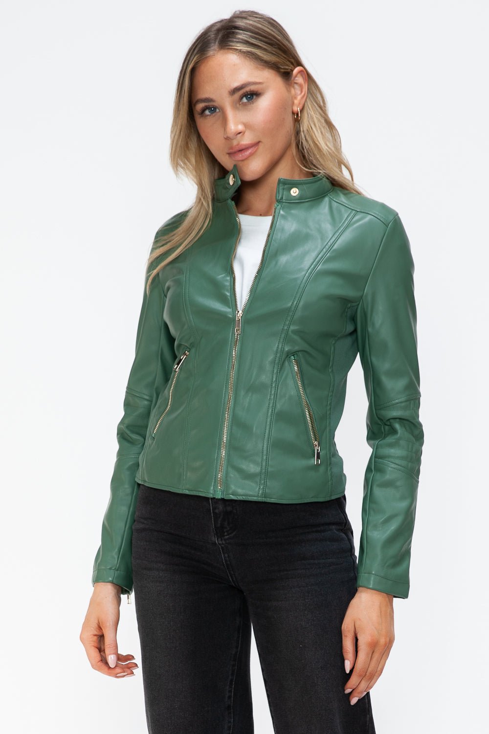 Stylish green faux leather zip-up jacket with pockets, featuring pleather material and drawstring hood, modeled by a person.