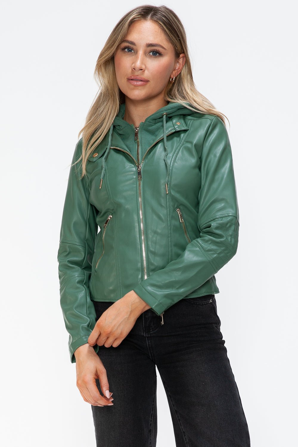 Woman wearing green faux leather zip-up drawstring hooded jacket with pockets, 100% pleather, perfect for casual style.