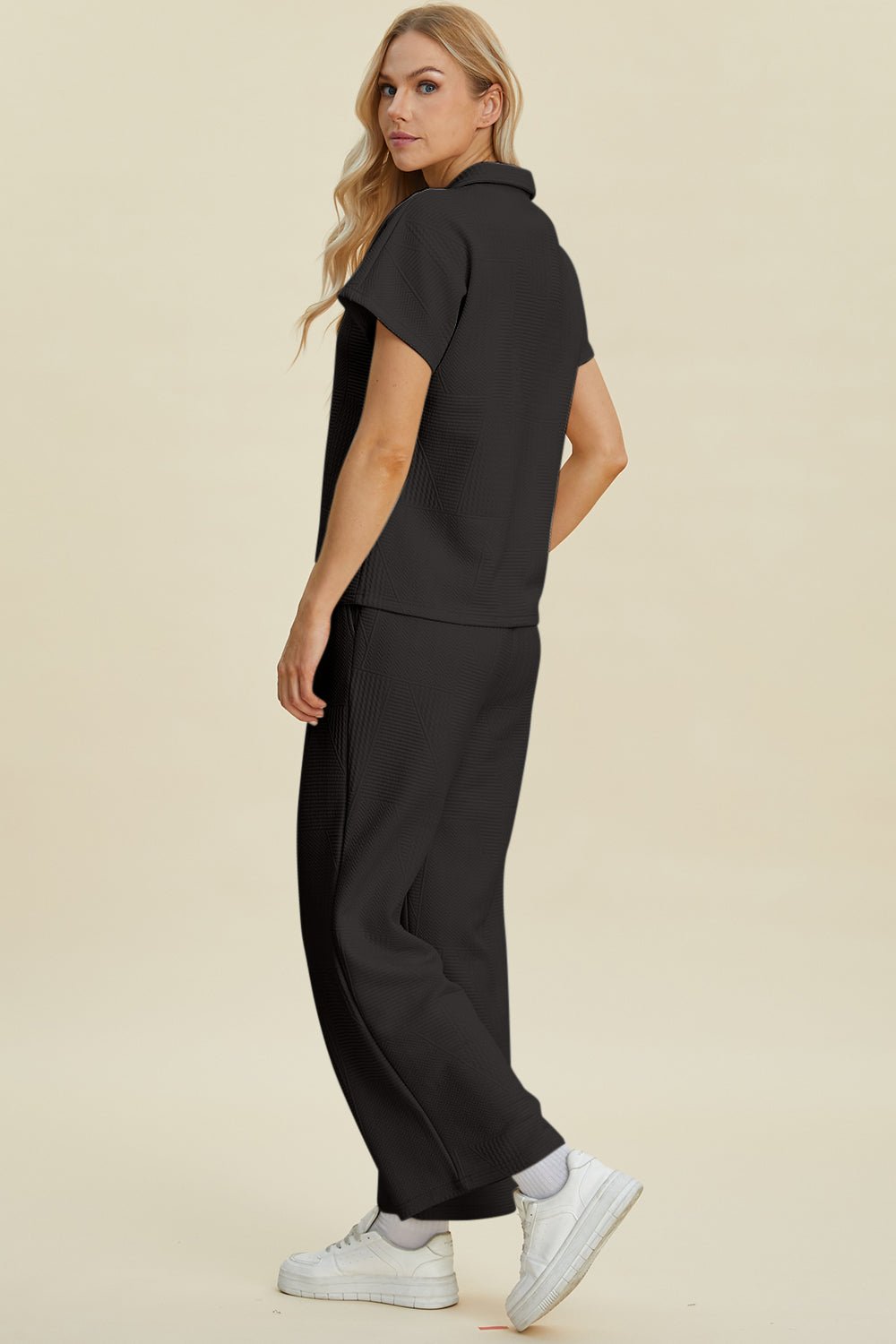 Full size collared neck short sleeve top and pants set in black, featuring a basic style, made of 98% polyester and 2% elastane.
