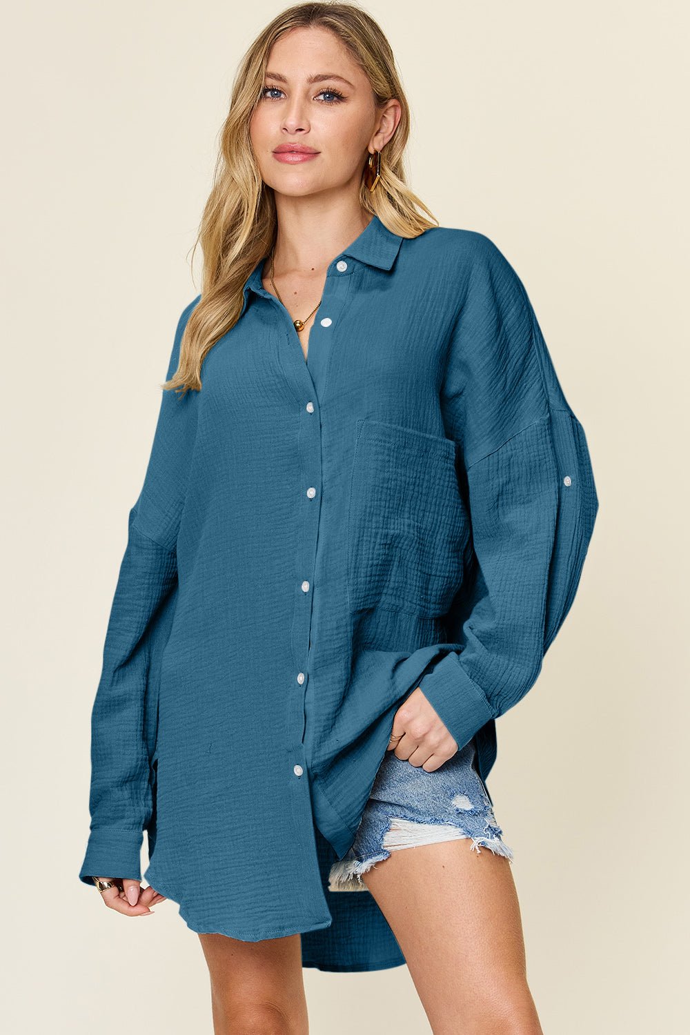 Full Size Pocketed Texture Button Up Shirt in teal, featuring a buttoned front, slightly stretchy cotton material, and a casual fit.