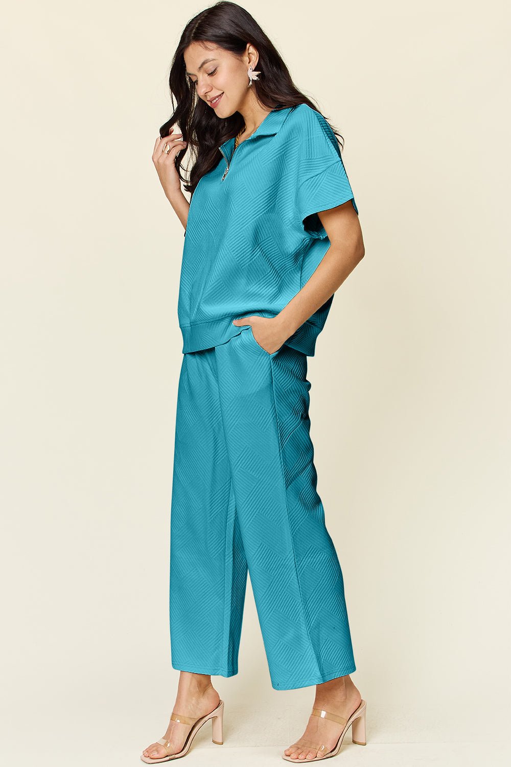 Teal full-size texture half zip short sleeve top and pants set, pocketed with drawstring, slightly stretchy polyester spandex fabric.