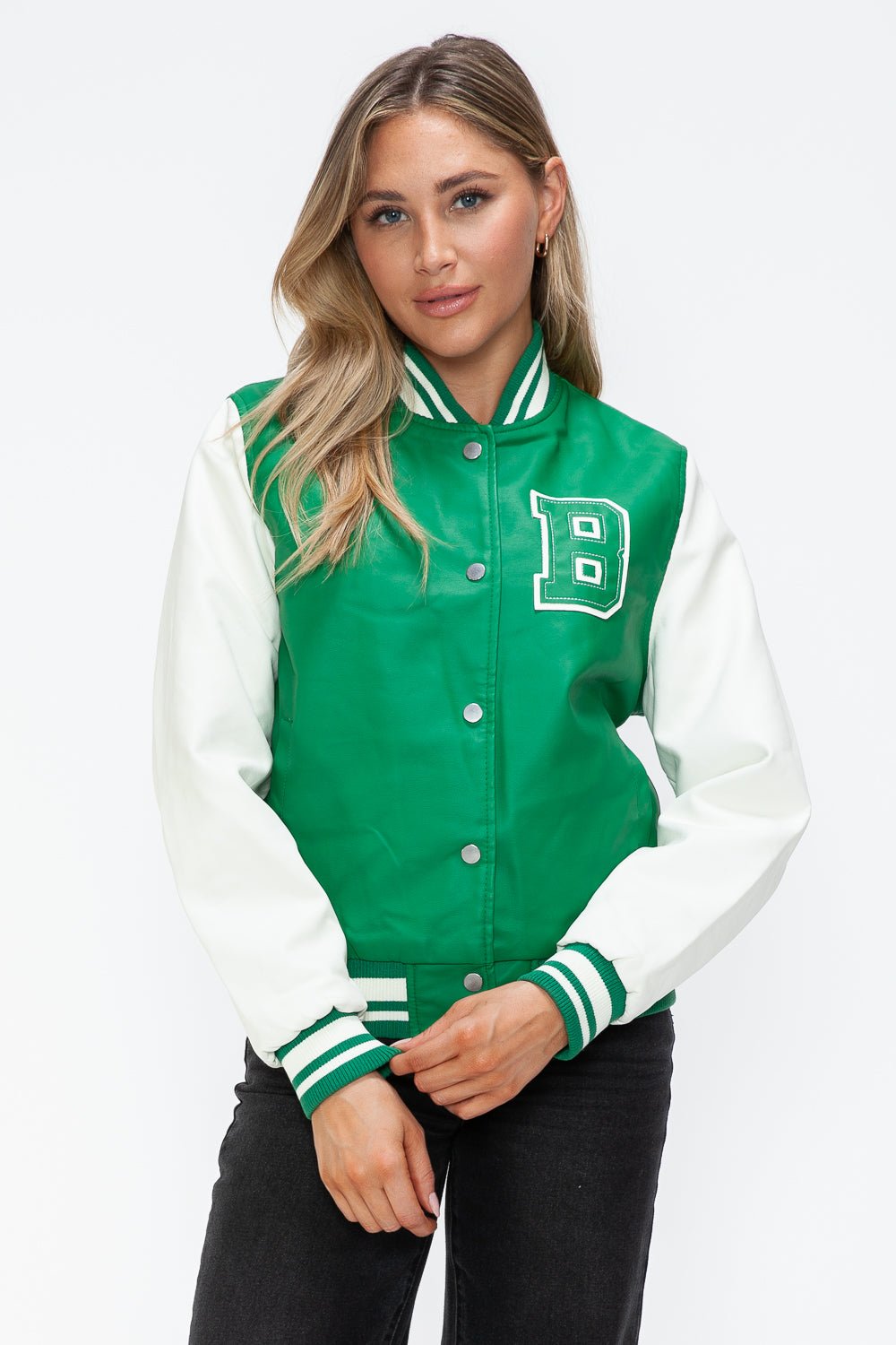 Green PU leather bomber jacket with white contrast sleeves, snap-down front, and varsity style.