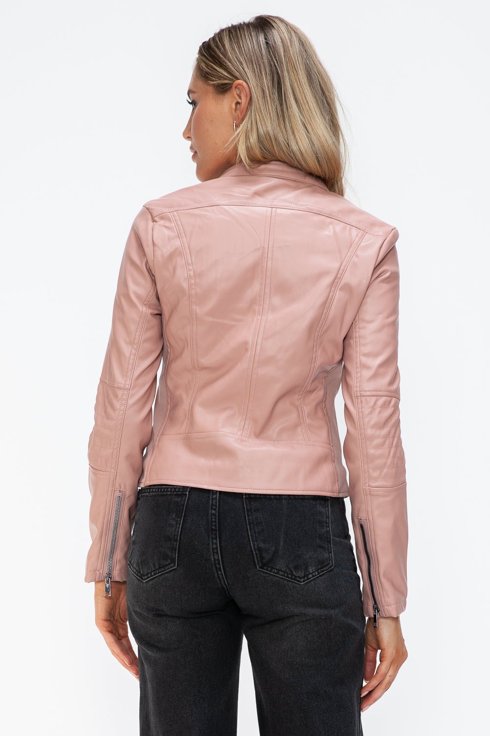 Woman wearing mauve faux leather zip-up hoodie with drawstring, viewed from the back, features normal thickness and pleather material.