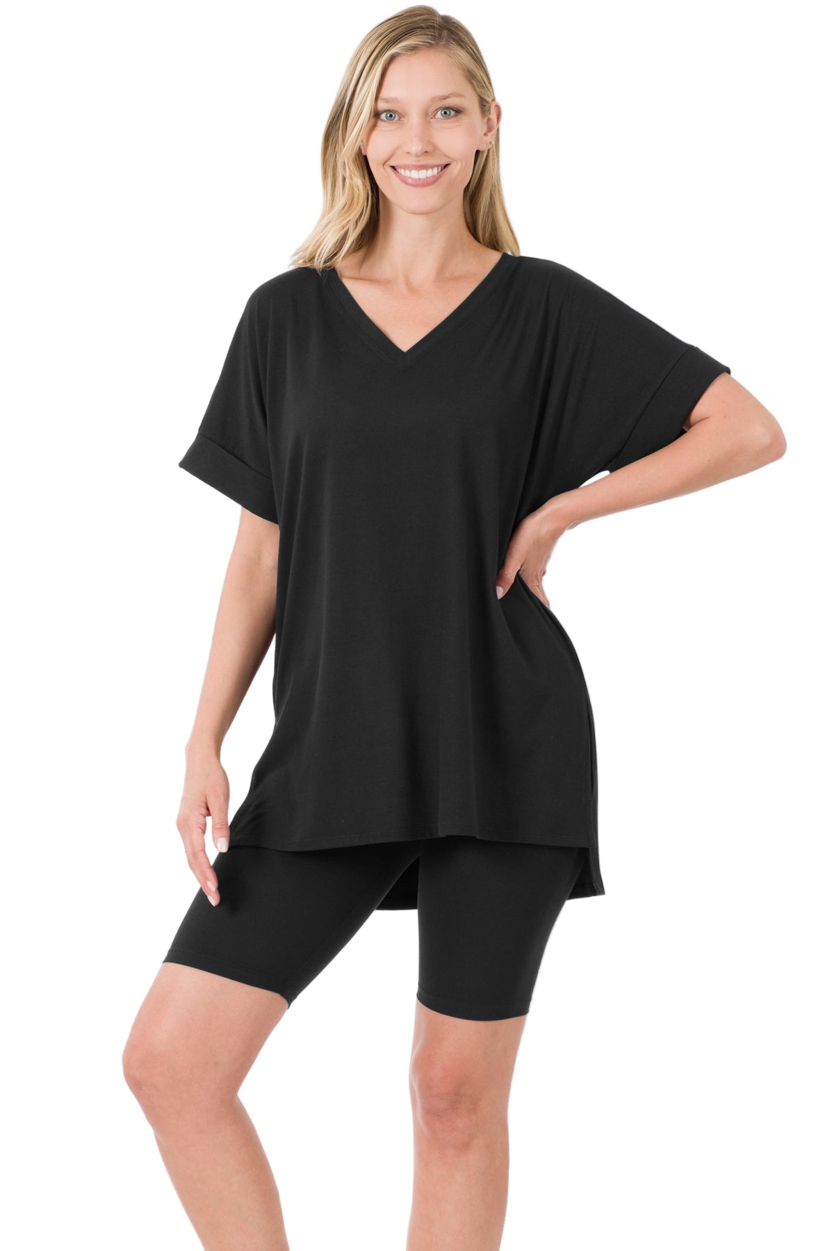 Woman wearing black brushed microfiber V-neck top and biker shorts set, showcasing a comfortable and stylish outfit.