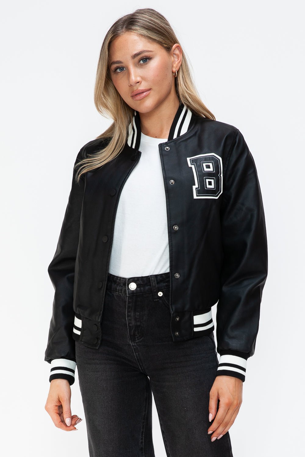 Woman wearing a Midnight Black PU Leather Contrast Snap Down Bomber Jacket with letter detail and striped cuffs.
