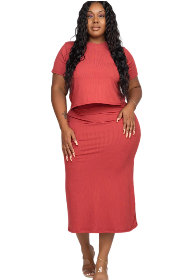 Plus size ribbed solid top and midi skirt set in red, featuring a soft, high stretch fabric with elasticized waist, worn by model.