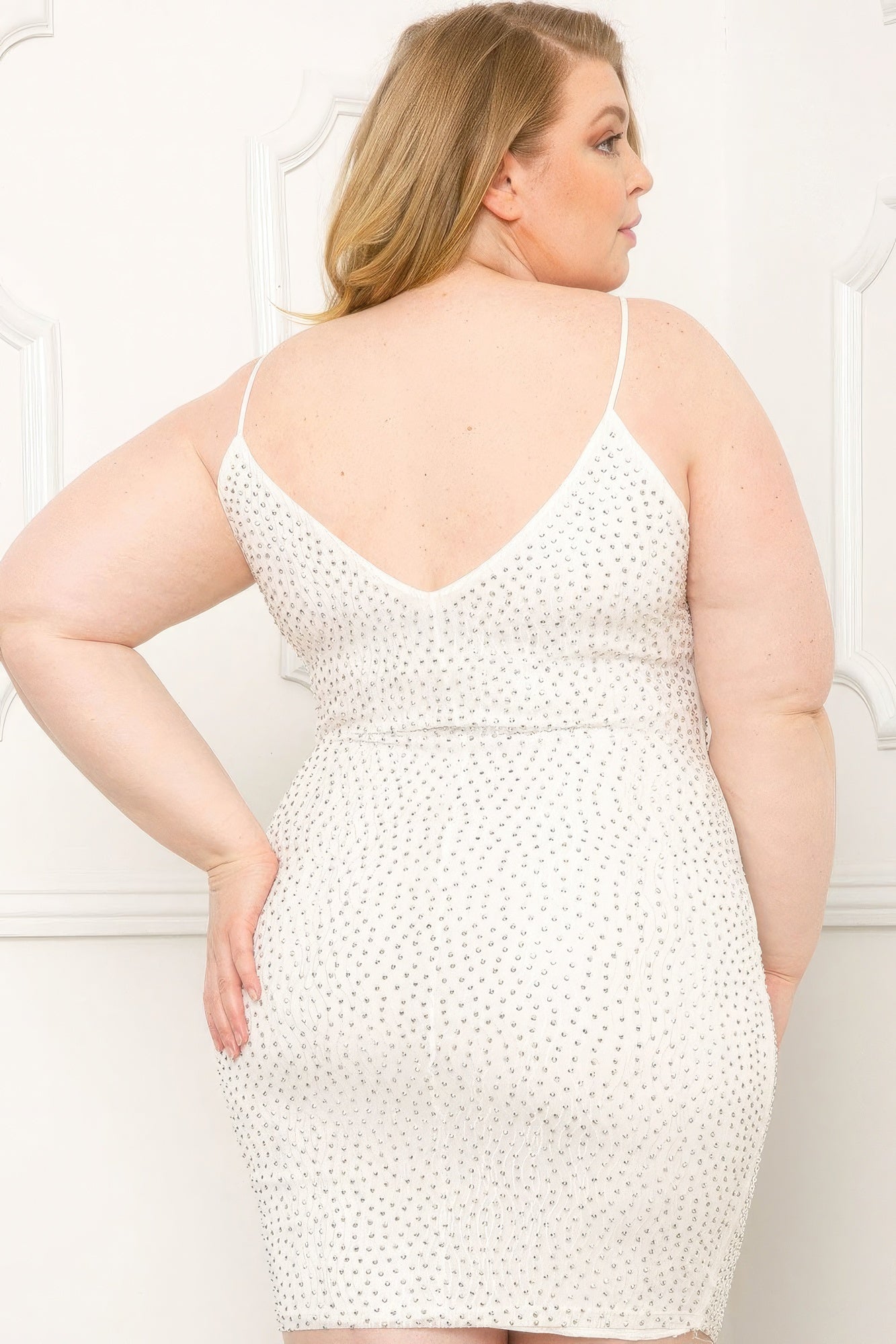Plus size mini dress with rhinestone details and V-neck, featuring spaghetti straps and a slip-on design in a red shade.