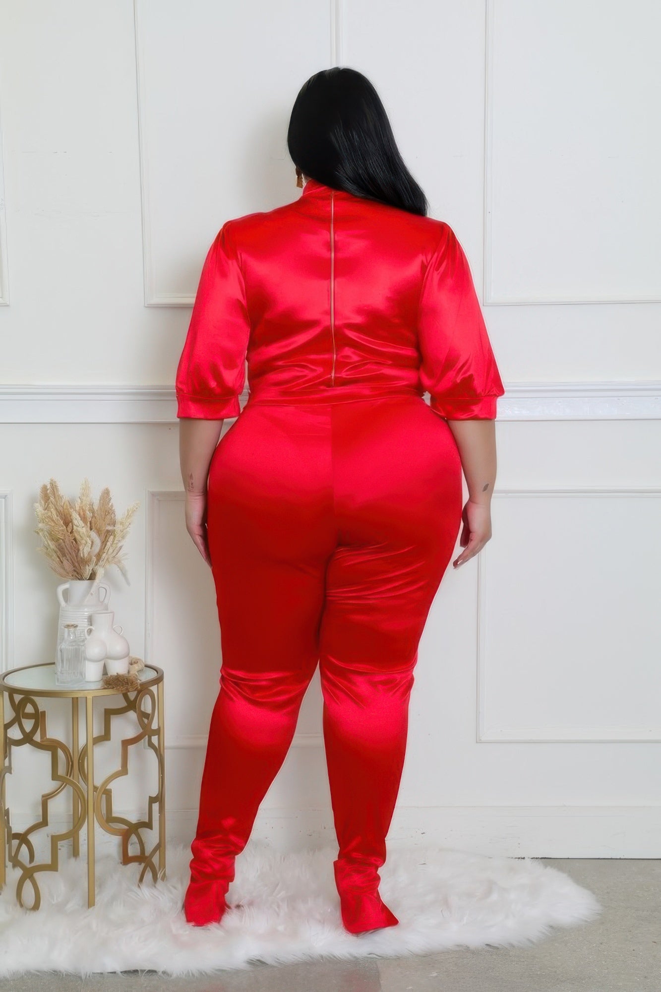 Bold red satin two-piece bodysuit set with high-waisted pants, perfect for accentuating curves with a touch of luxury.