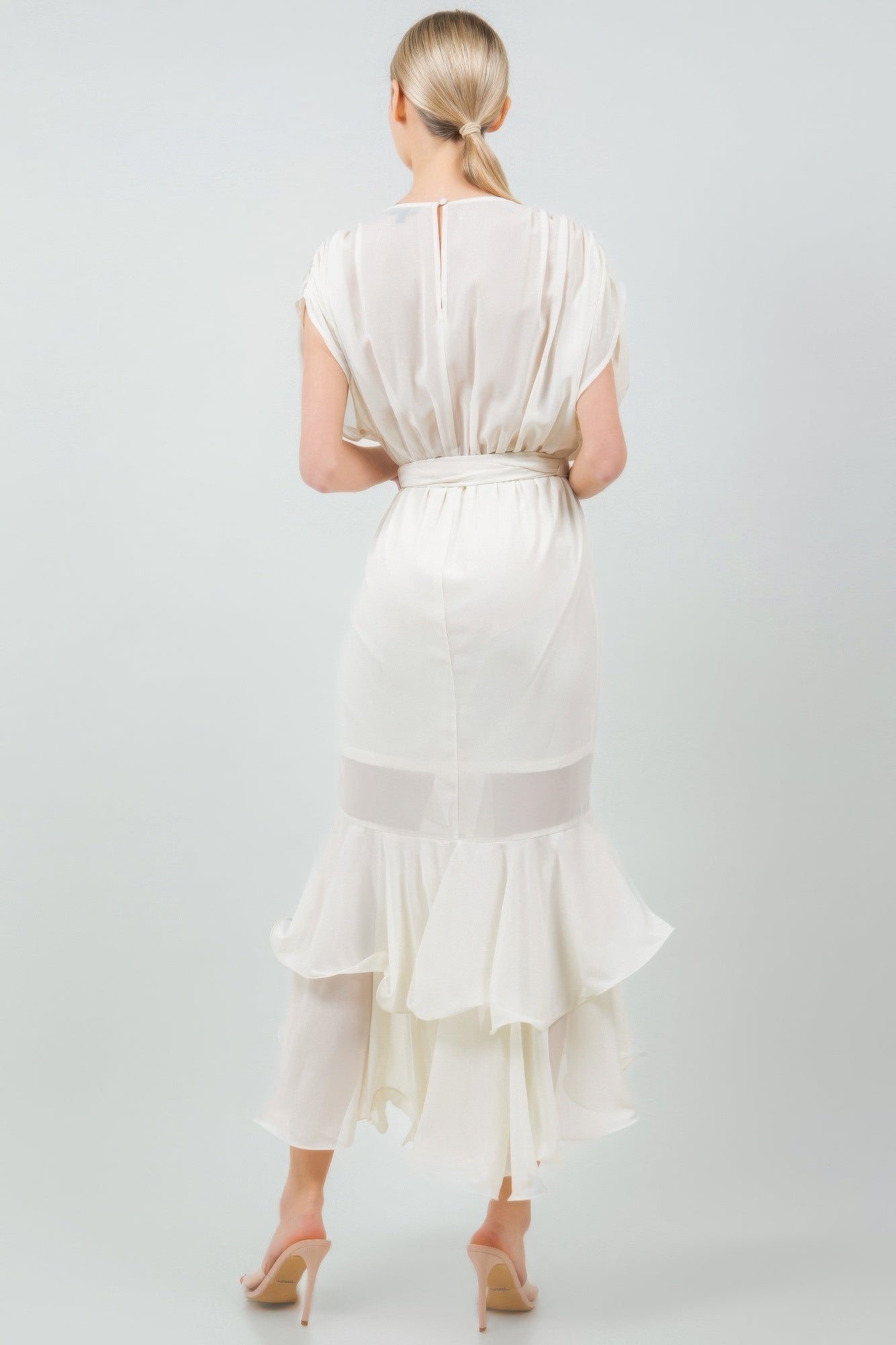 Back view of woman wearing a white tie waist ruffle midi dress with elegant detailing, perfect for a stylish and comfortable look.
