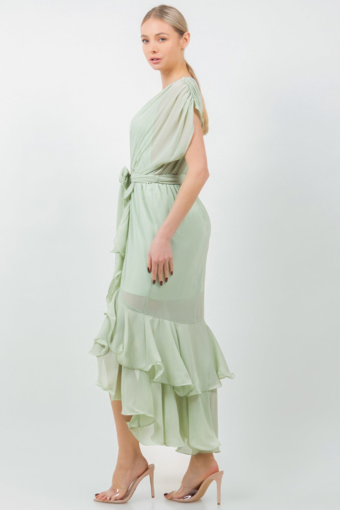 Woman in a mauve Solid Tie Waist Ruffle Midi Dress, showcasing elegant ruffle detailing and flattering tie waist, ideal for various occasions.
