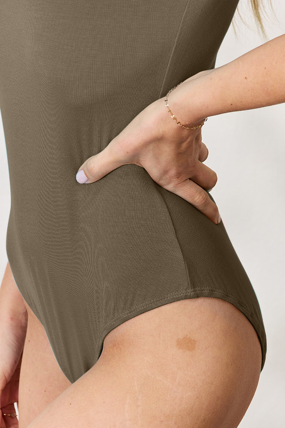 Olive green Basic Bae round neck short sleeve bodysuit with moderate stretch, rayon-spandex blend fabric for comfortable wear.