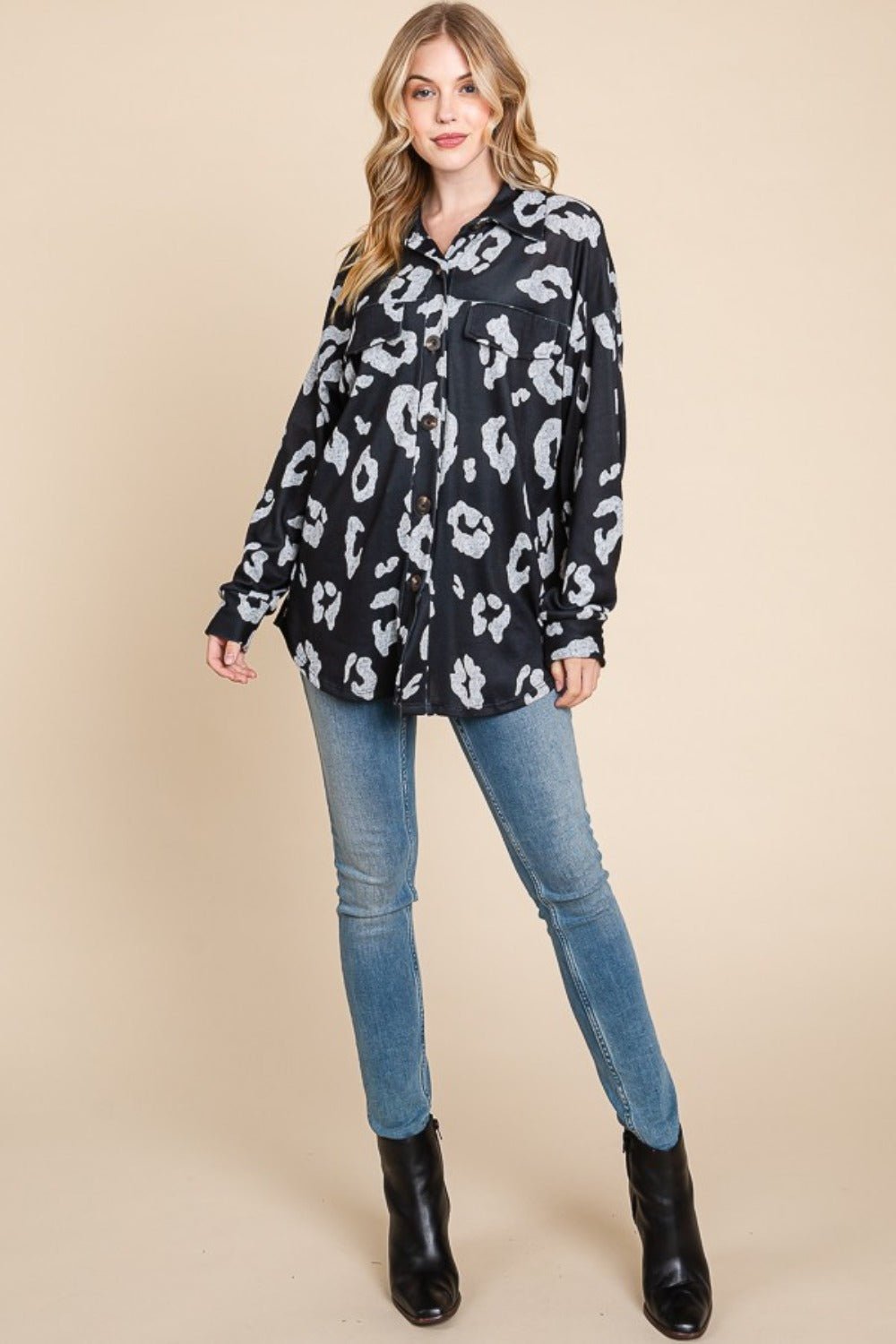 Stylish animal print button-up knit shacket with pockets, slightly stretchy, made from 95% polyester and 5% spandex.