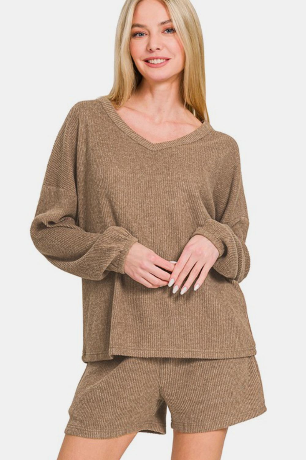Woman wearing camel V-neck long sleeve ribbed top and shorts set, featuring a slightly stretchy, two-piece outfit made of polyester blend.