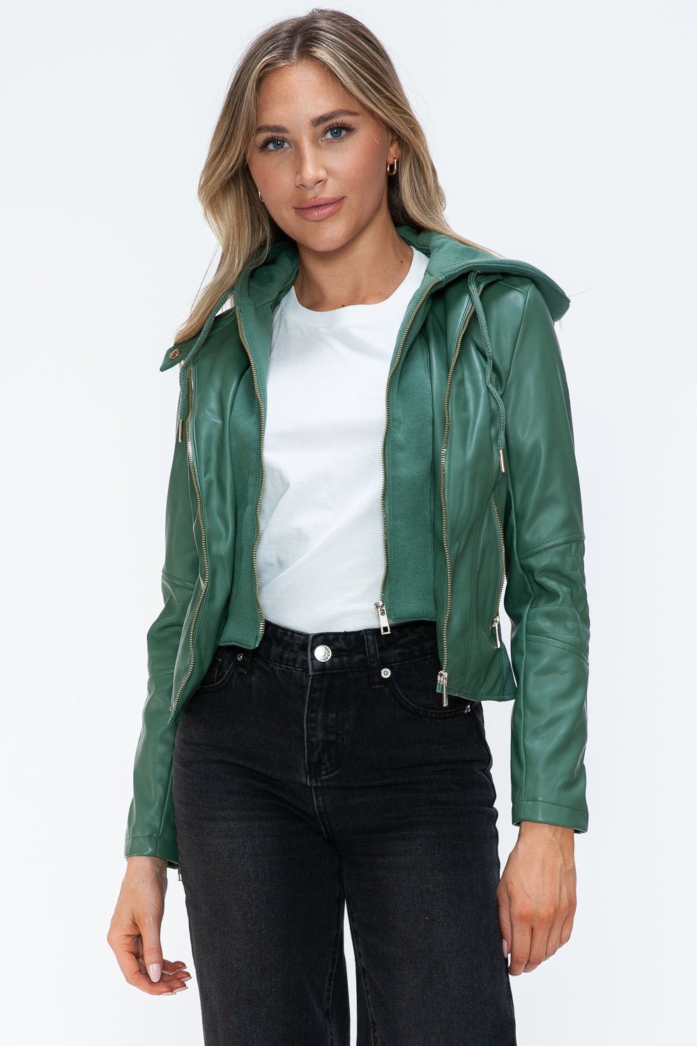 Stylish woman wearing a green faux leather zip-up jacket with drawstring hood, showcasing casual fashion with a basic style and pockets.