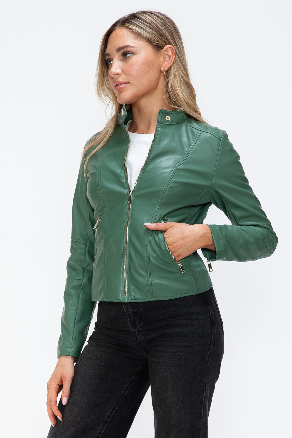 Woman wearing green faux leather zip-up jacket with a stylish design.
