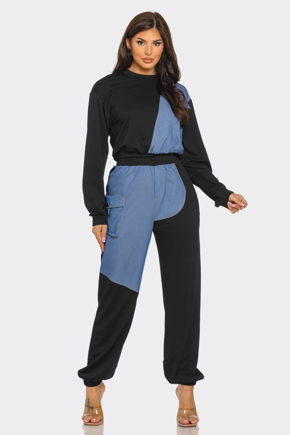 Woman wearing a French Terry color block denim detail top and pants set with round neck and long sleeves, featuring a stylish design.