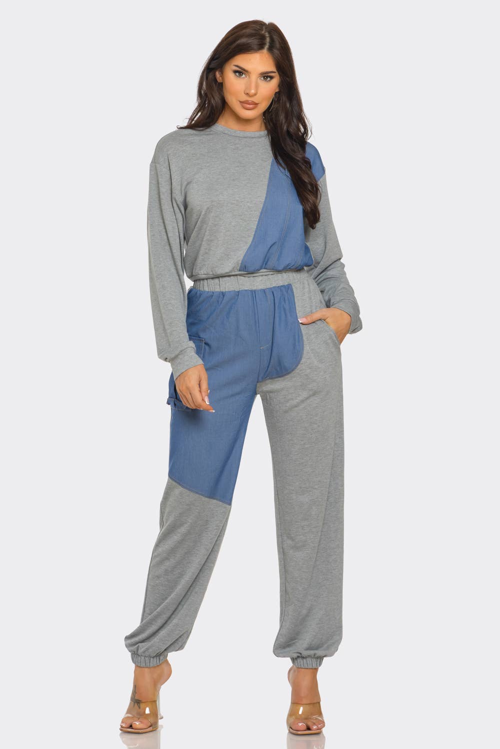 Stylish woman wearing French Terry Color Block Denim Detail Top and Pants Set with pockets and elastic waistband.