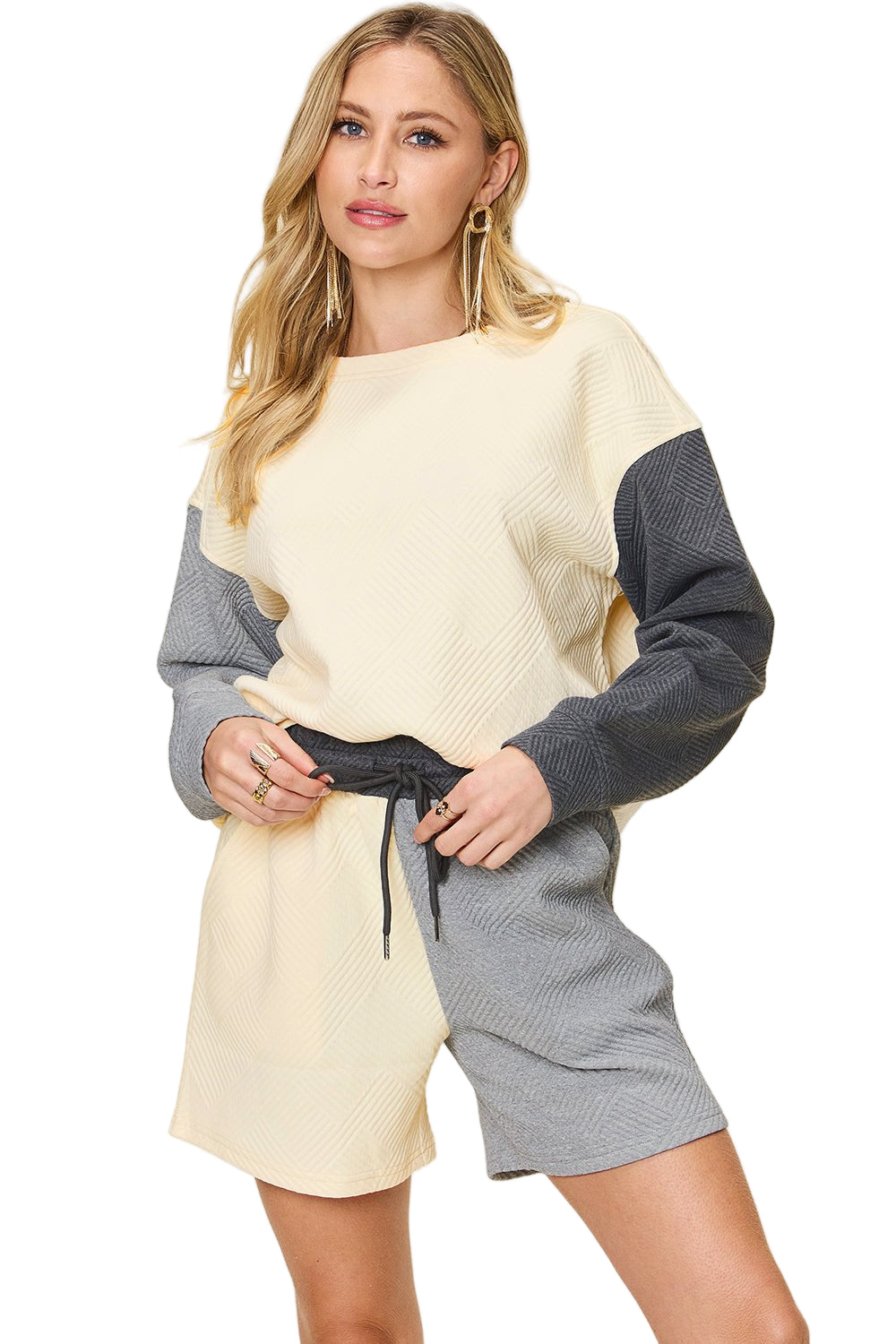 Full size contrast drop shoulder top and shorts set with pocketed design, drawstring waist, in cream and gray tones.
