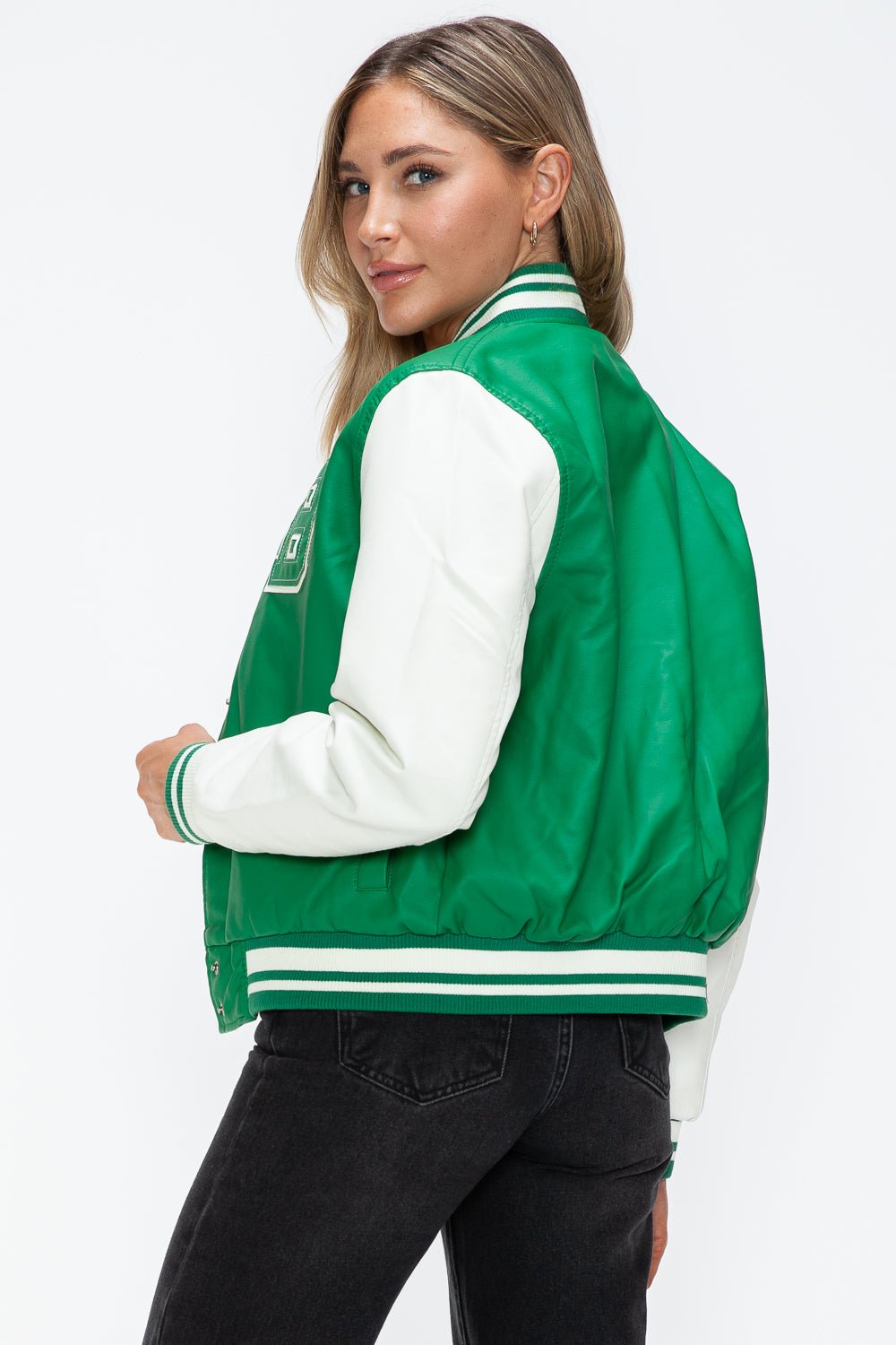 Stylish green PU leather bomber jacket with white sleeves and snap down collar, perfect for a trendy and casual look.