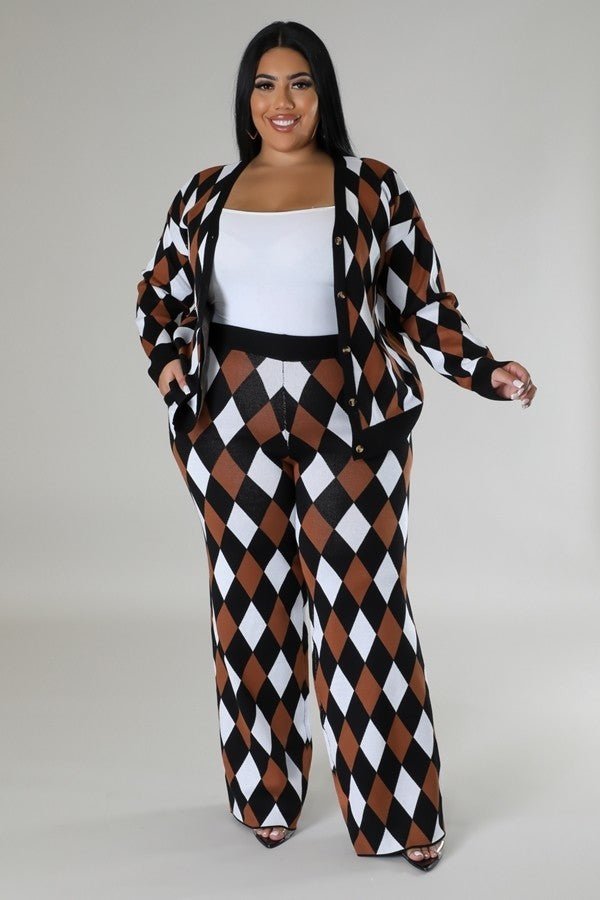 Long sleeve black and multi diamond pattern two-piece pant set, stretch fabric, button closure, high-waisted with elastic waistband.