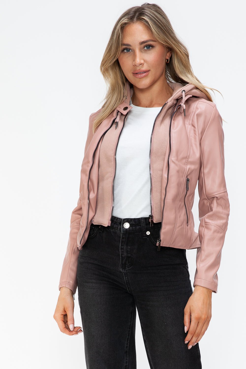Mauve faux leather hooded jacket with zip-up and drawstring, basic style, worn by a person over a white shirt and black pants.