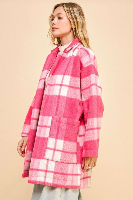 Pink plaid longline coat with open front and drop shoulders, featuring large front pockets, made of 100% polyester.