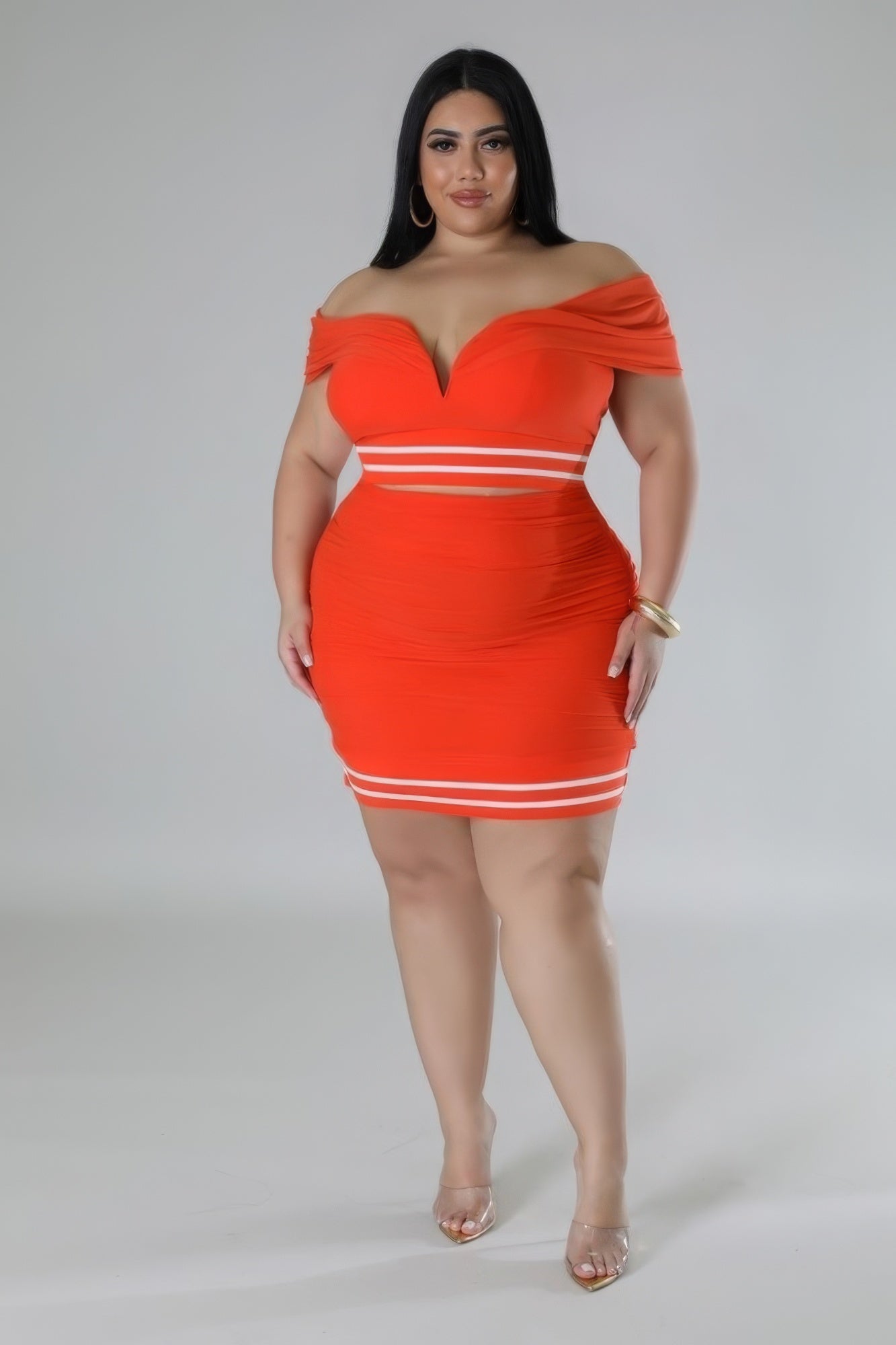 Plus-size orange stretch skirt set with off-the-shoulder design, sweetheart neckline, and mesh accents. Perfect for 1XL-3XL.