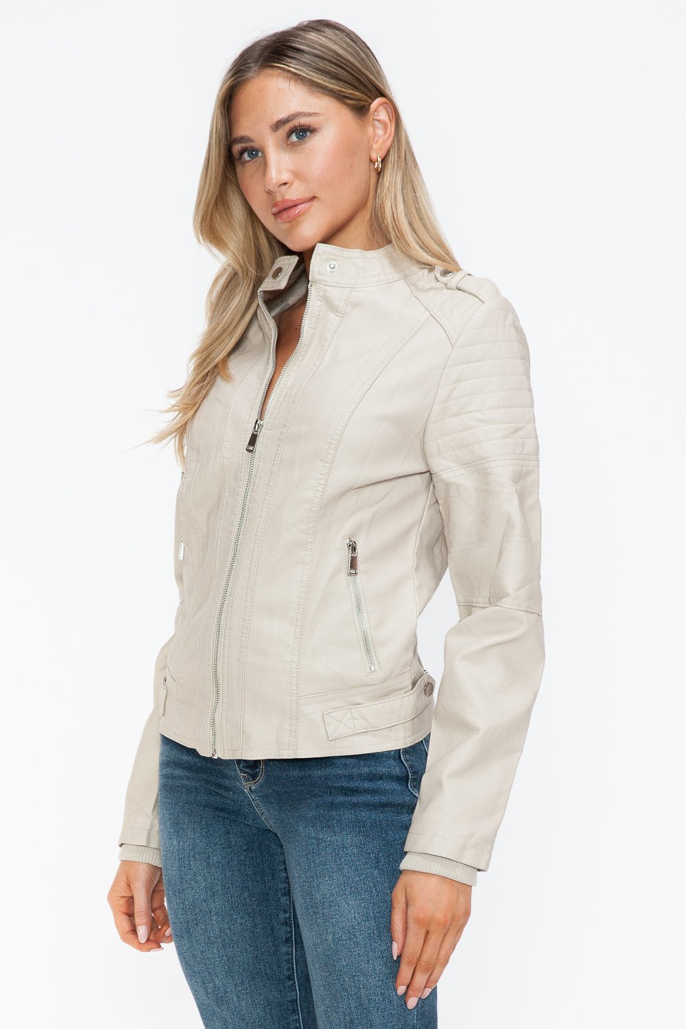 Stylish sand PU leather biker jacket with side zip pockets, featuring a basic style and normal thickness, worn by a woman.