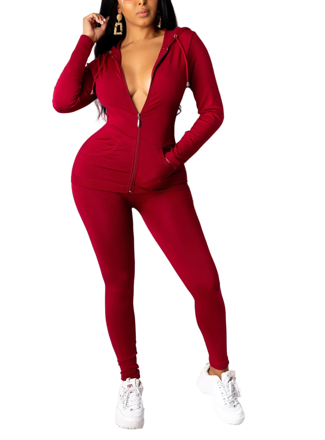 Woman wearing a burgundy solid hoodie leggings set made of polyester and spandex, showcasing comfortable fashion with white sneakers.