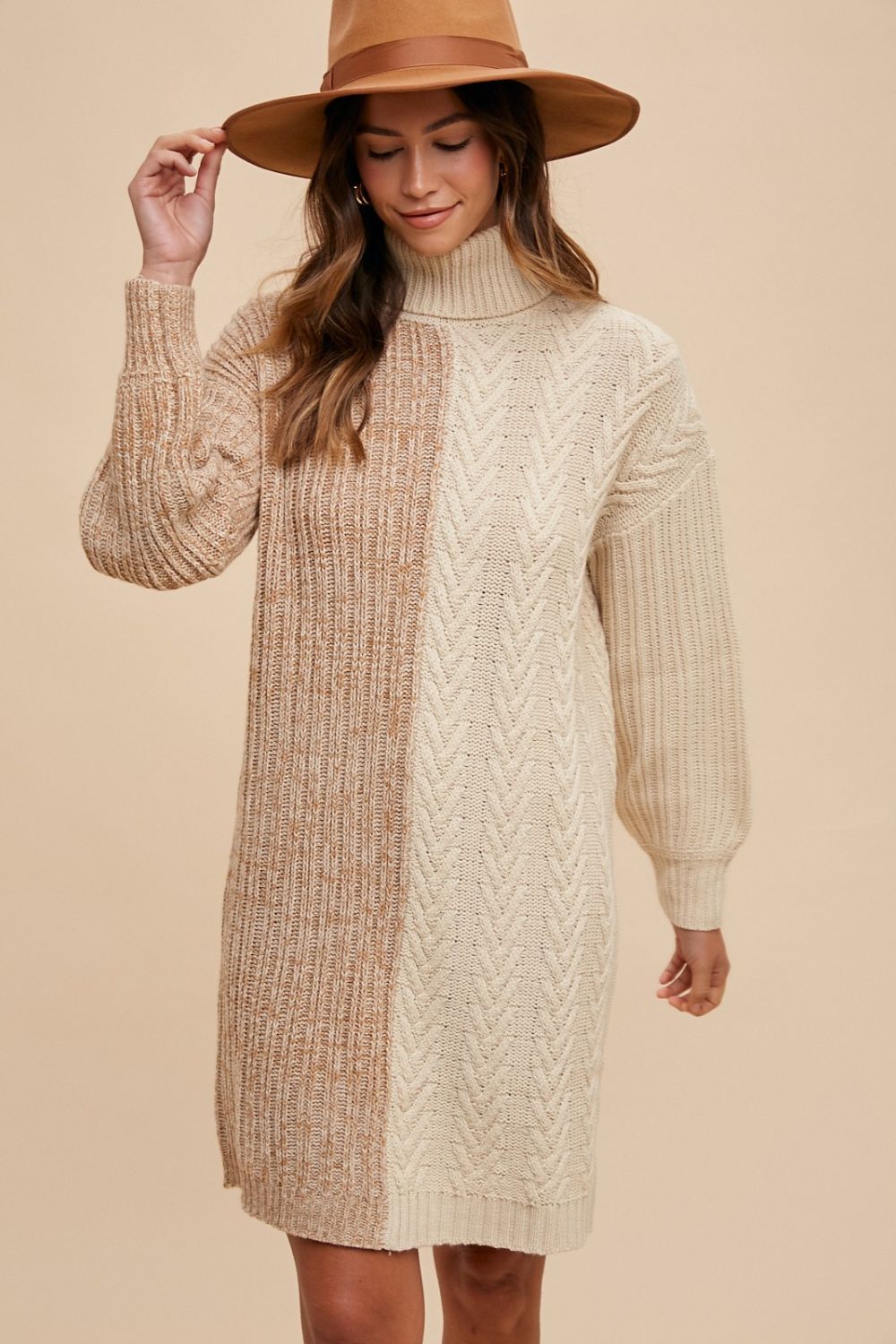 Stylish winter color block turtleneck sweater dress in beige tones, featuring ribbed knit design and slightly stretchy 100% acrylic material.